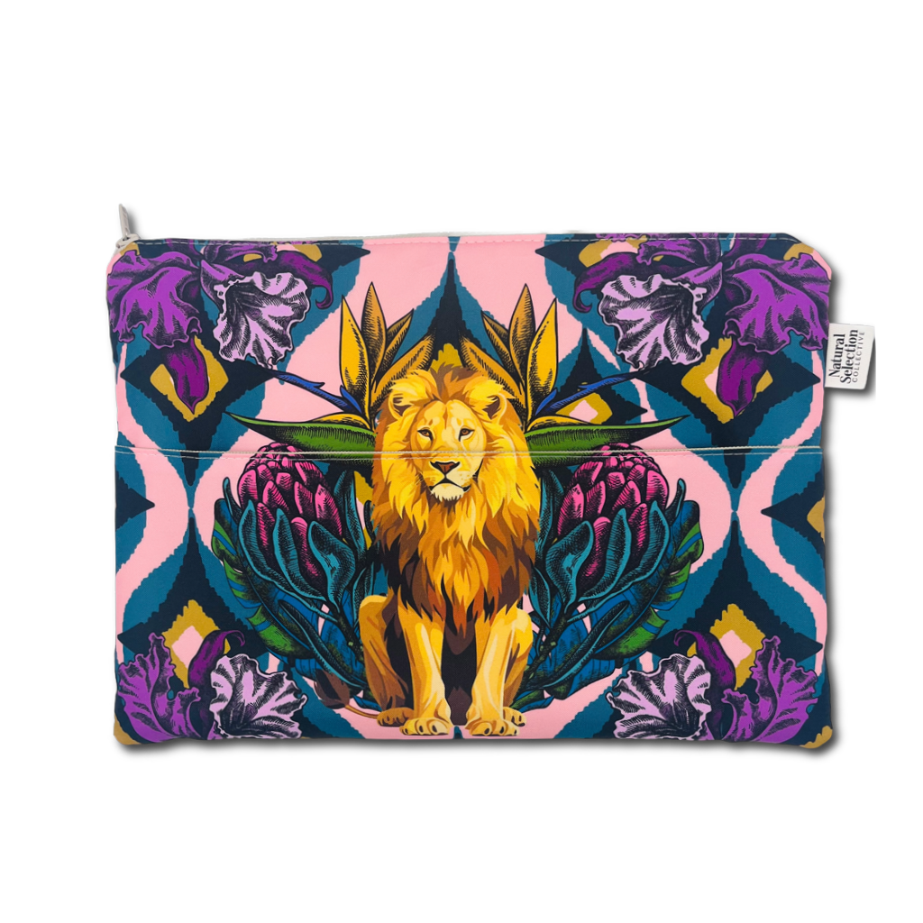A zippered pouch featuring a vibrant, symmetrical graphic print of a golden lion seated among purple flowers and teal leaves on a pink and blue background, with a small white brand tag on the right side.