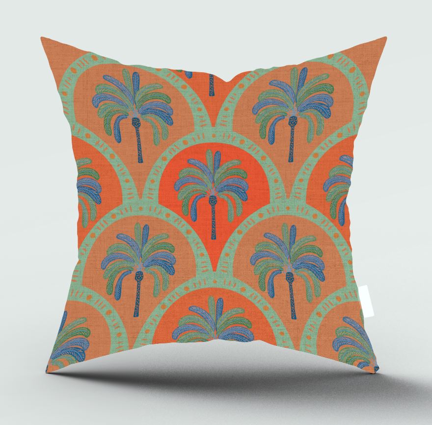A square throw pillow featuring a retro bohemian pattern with orange and mint green semicircles, blue palm trees, and turquoise script text, shown on a light gray background.