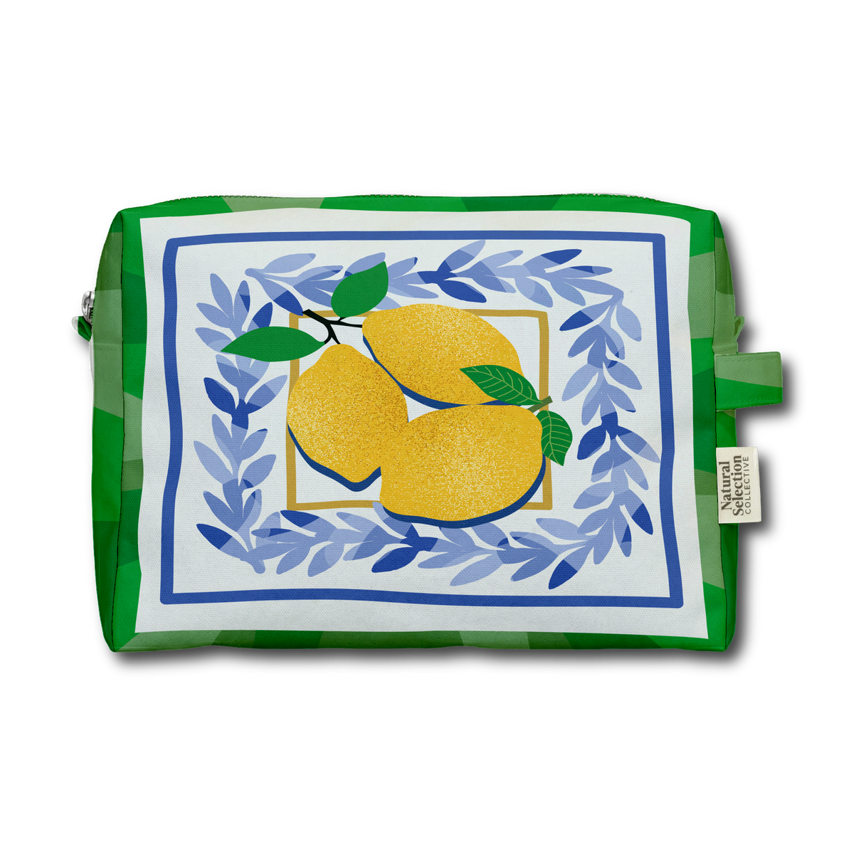 A green and white patterned zippered pouch featuring a central illustration of two yellow lemons framed by blue leafy laurel branches on a white background. A small fabric brand tag on the right side reads 'The Artisanal Shop'.