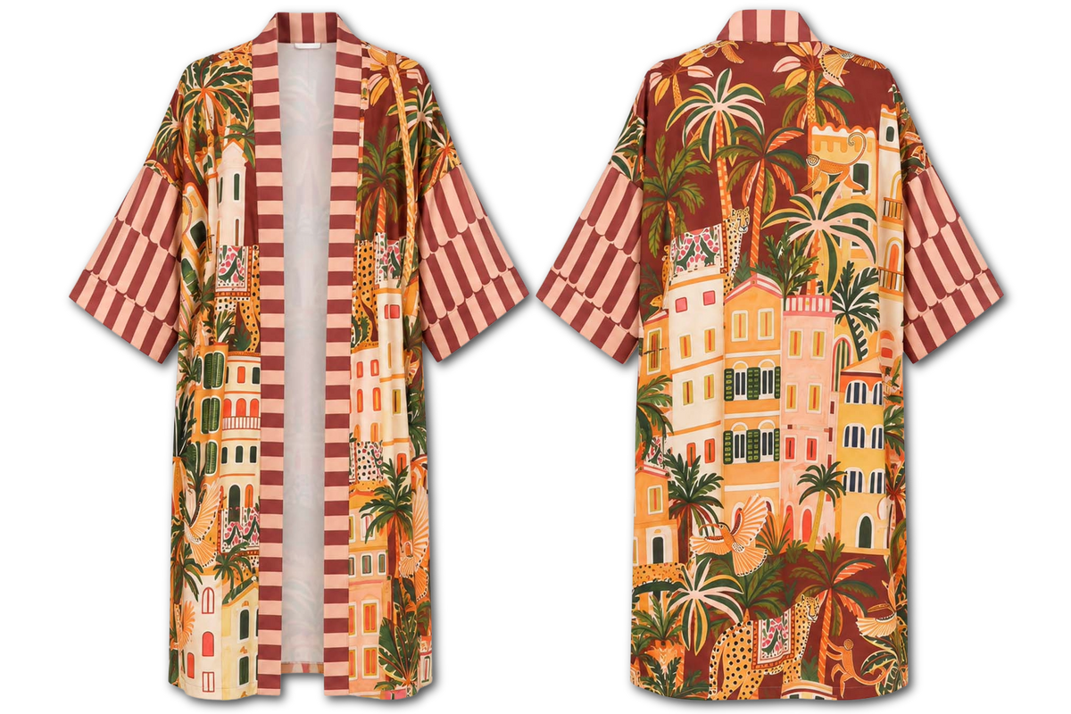A short-sleeve open-front robe shown from both front and back on a white background. The robe features a colorful tropical coastal village print with palm trees, buildings, and animals, plus striped sleeves and a white inner lining.