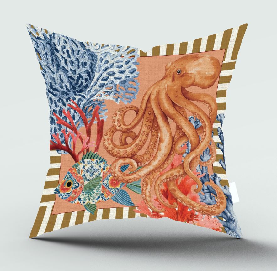 A square decorative throw pillow featuring a colorful underwater illustration with a large orange octopus, blue coral, and a blue-and-green fish on a peach background, finished with a striped border in brown and cream.