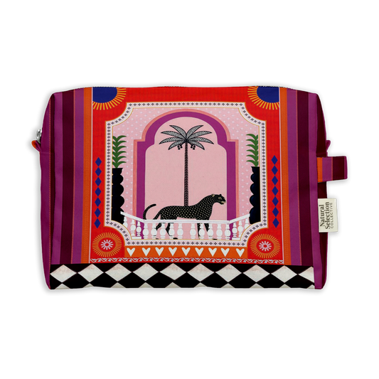 Apricity Leo Toiletry Bag featuring a black leopard and palm tree in a pink arch with purple stripes