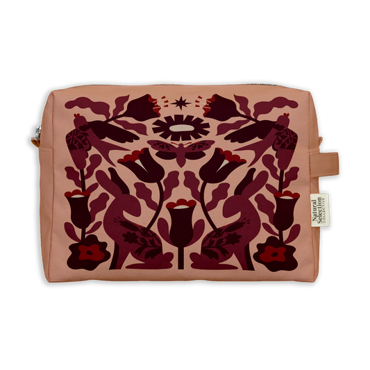 Autumn Garden Toiletry Bag featuring burgundy hares and tulips in a symmetrical pattern on blush