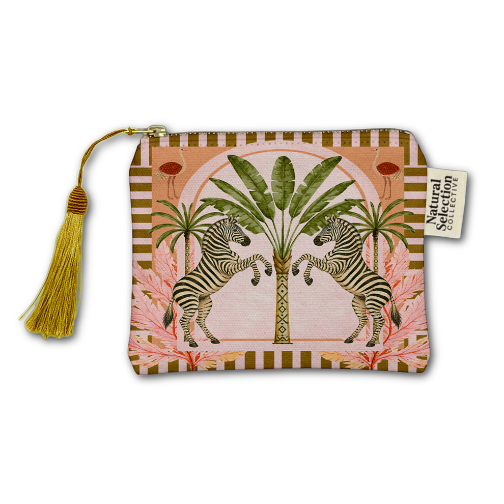 A zippered pouch featuring a tropical safari design with two rearing zebras, palm trees, pink flowers, and a gold tassel zipper pull, shown on a plain white background.