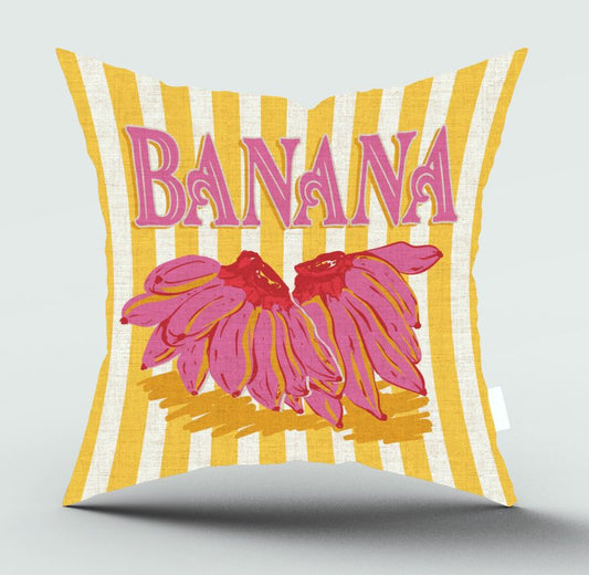 A square throw pillow featuring a retro design with yellow and white vertical stripes, pink 'BANANA' text, and pink bananas on a light gray background.