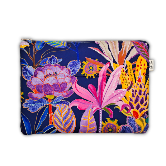 A zippered pouch featuring a vibrant, multicolored botanical print on a dark navy blue background. The print includes large pink flowers, purple blossoms, yellow sunflowers, and blue leaves.