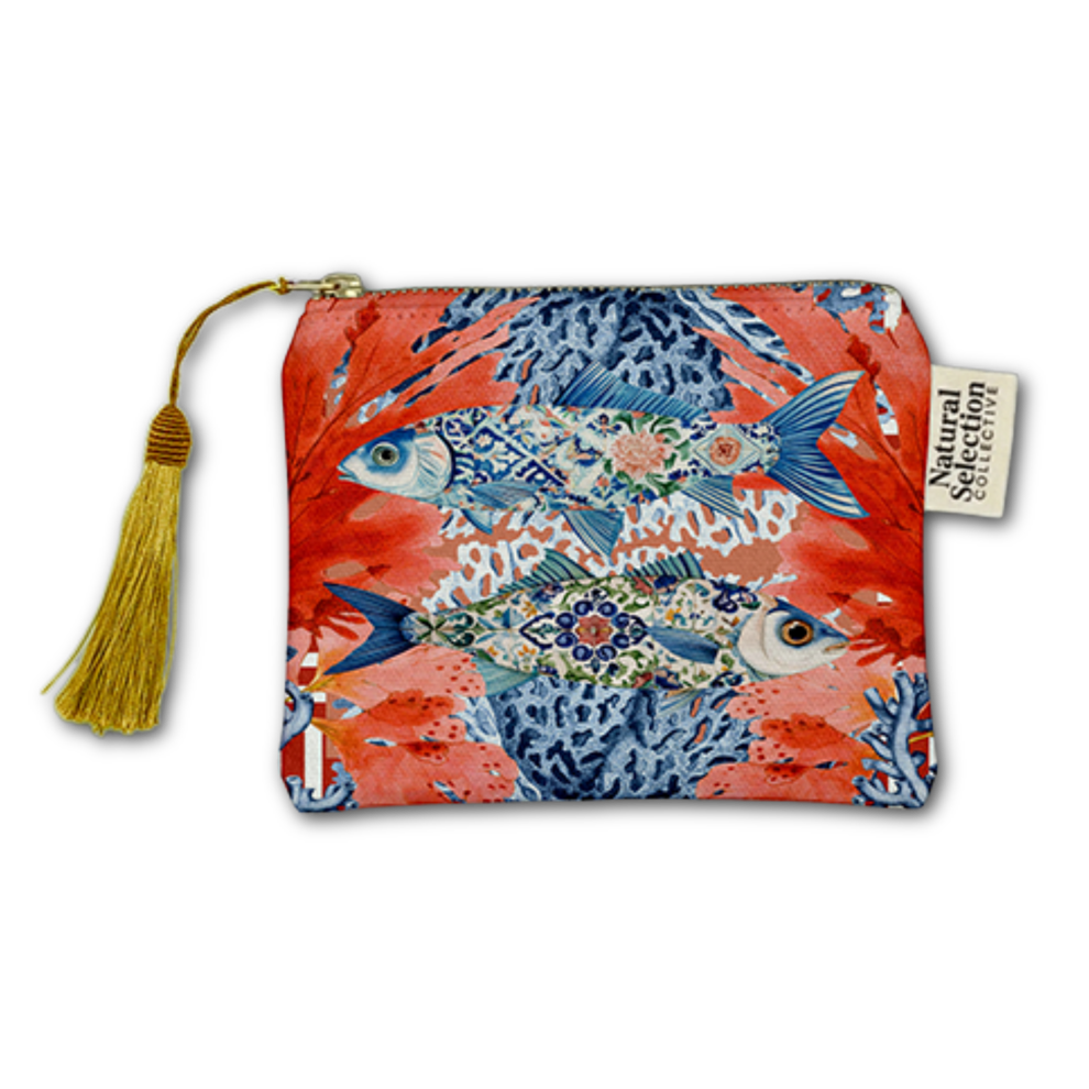 A zippered pouch featuring a vibrant red and blue fish pattern, complete with a gold tassel zipper pull and a 'Natural Selection' brand tag.