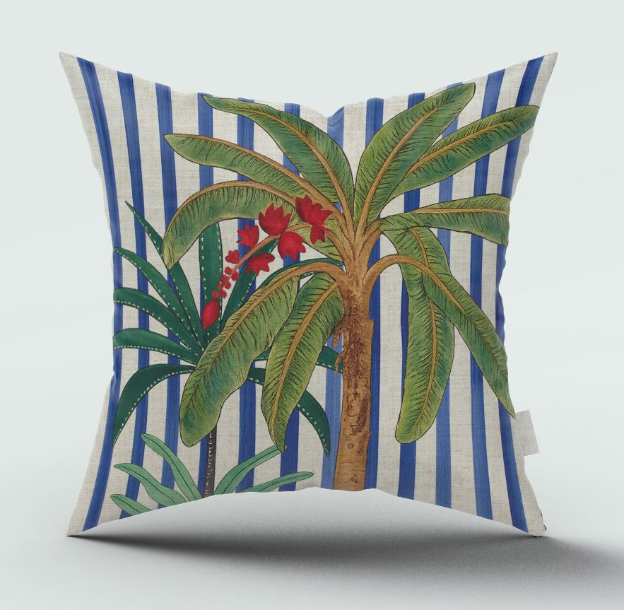 Decorative pillow with palm tree and striped pattern on a white background