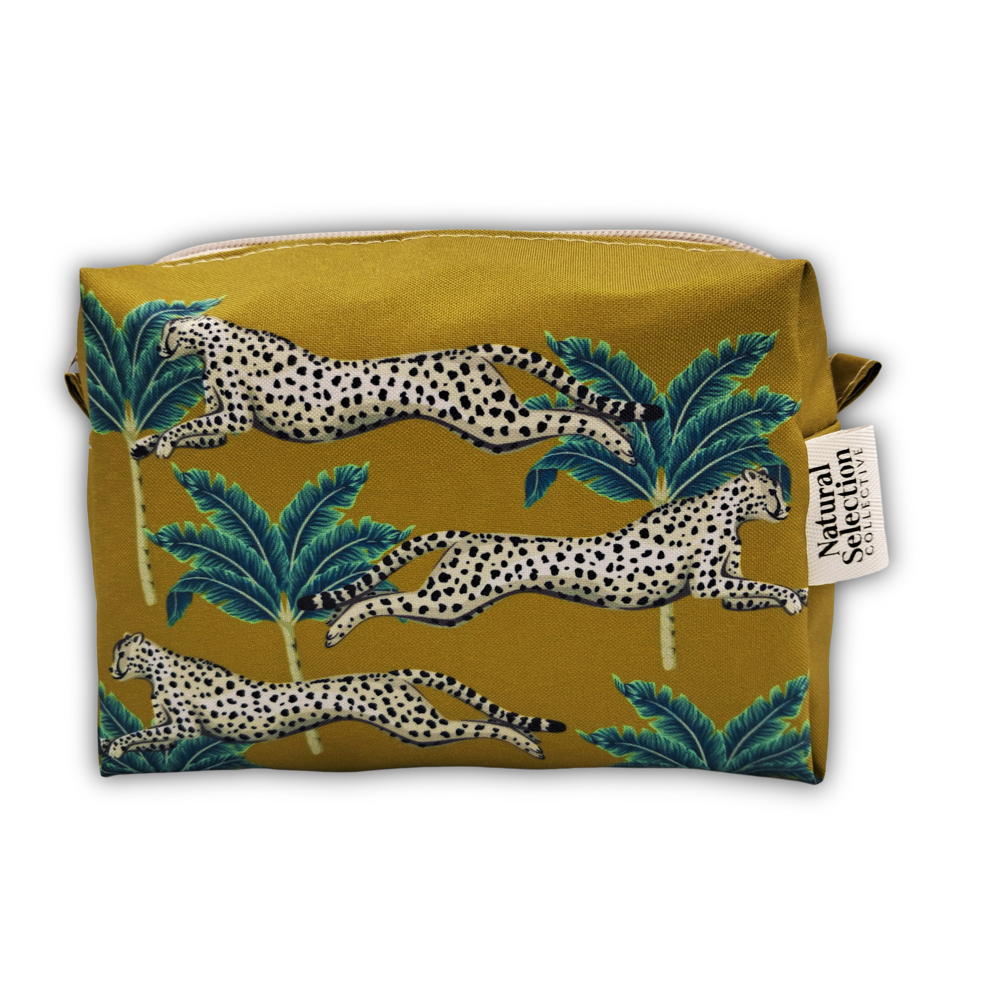 A rectangular zippered pouch featuring a mustard yellow background with a pattern of leaping spotted cats and green palm trees. A white fabric tag on the right side reads 'Natural Selection'.