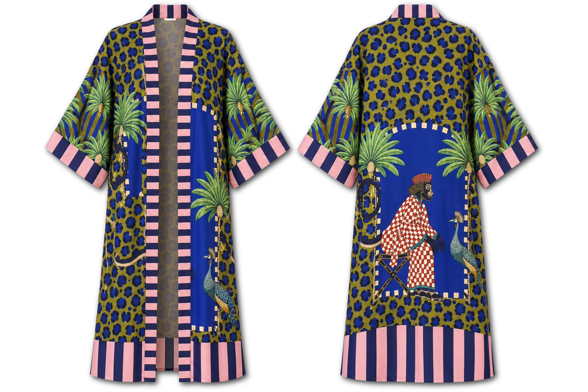 A long open-front robe shown from both front and back on a white background. The robe has a blue base with a dark leopard print, pink striped trim, green palm trees, and a central illustrated figure in red-and-white checkered clothing.