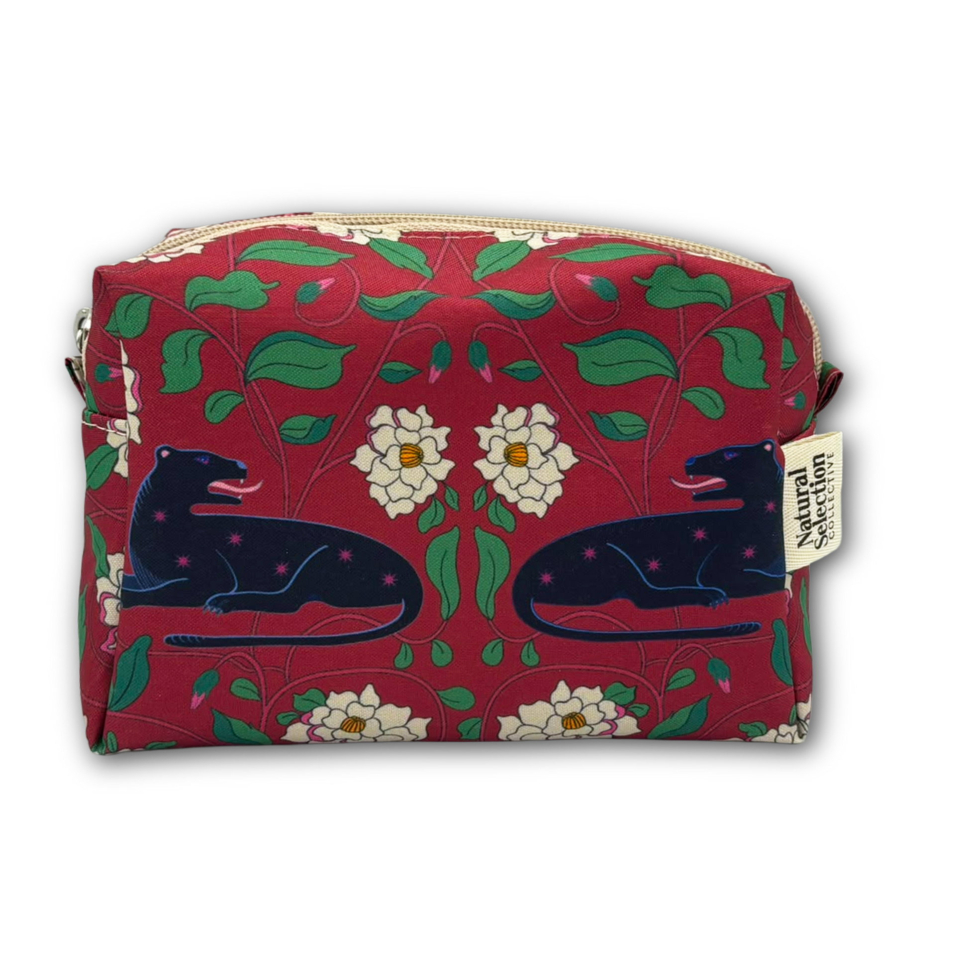 A rectangular zippered pouch with a red background and a repeating pattern of green leaves, white flowers, and dark blue panthers. A small fabric tag on the right side reads 'Natural Living'.
