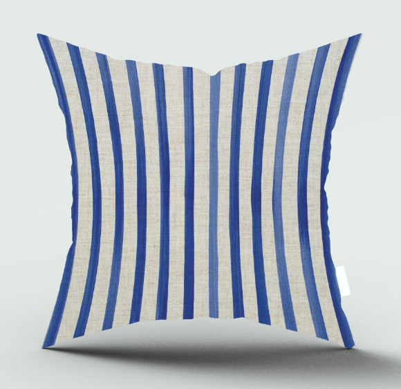 A square throw pillow with vertical stripes in royal blue and a warm off-white linen-like fabric, shown against a neutral light gray background with a soft shadow underneath.