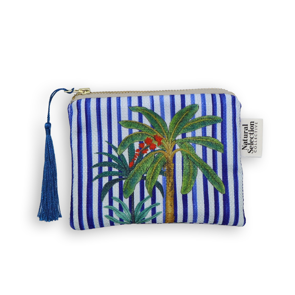 Striped pouch with palm tree design and tassel on a white background