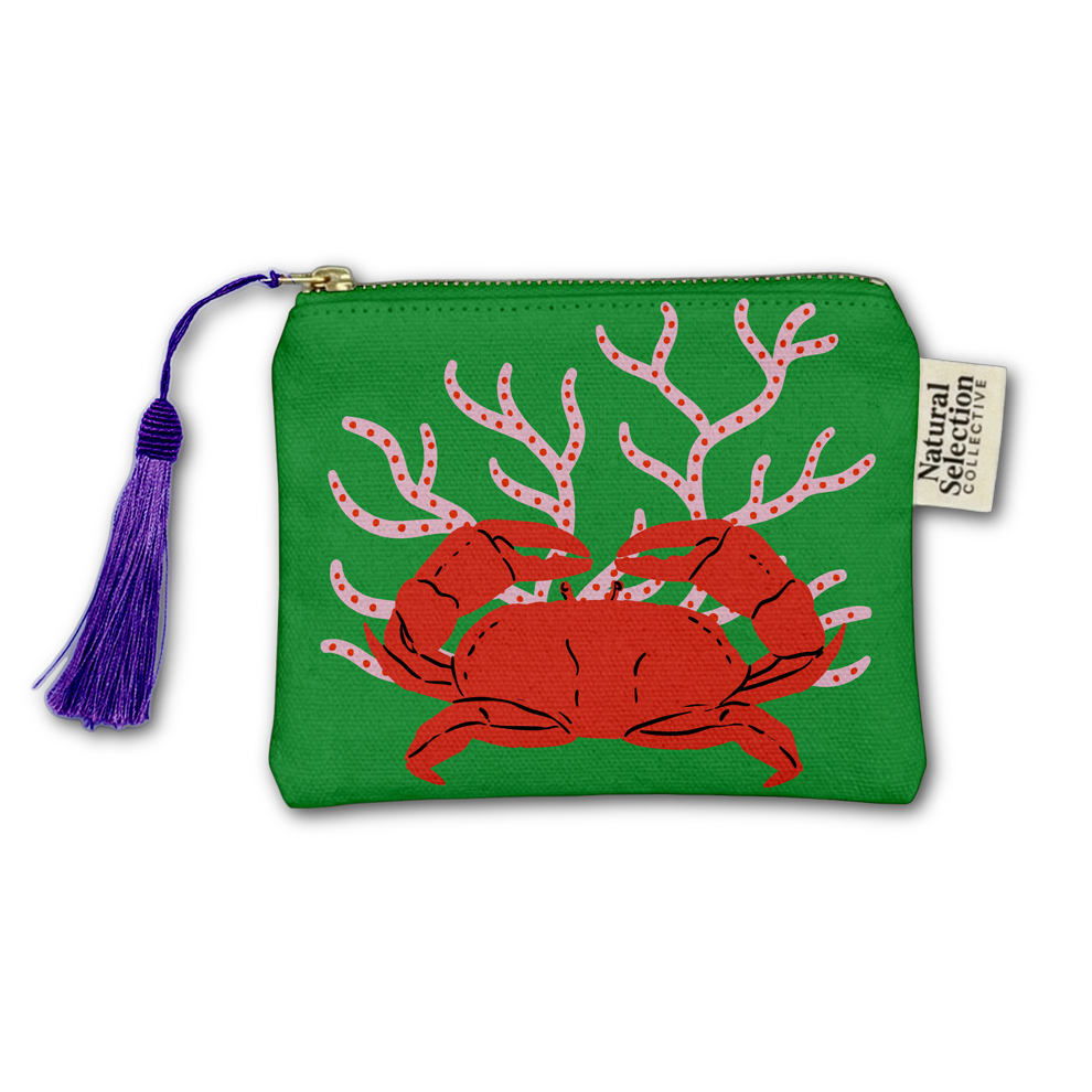 A green zippered pouch featuring a red crab and pink coral design, with a purple tassel zipper pull and a white fabric brand tag reading Natural Sentiments.