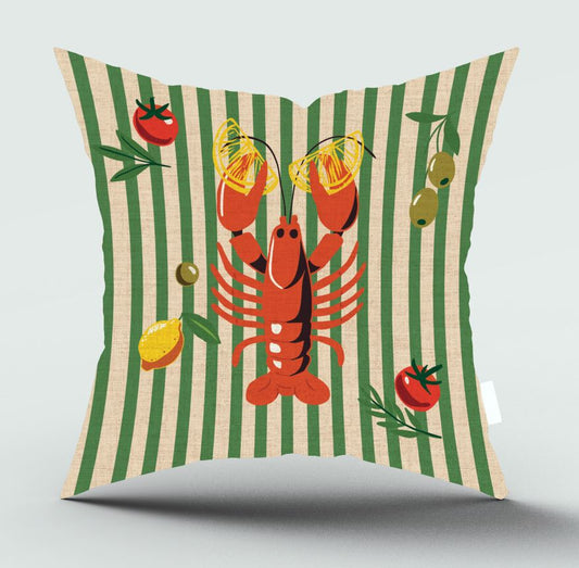 A square decorative throw pillow with a green and beige striped background, featuring a central red lobster holding yellow lemon halves, with tomatoes, olives, and lemon slices illustrated around it.