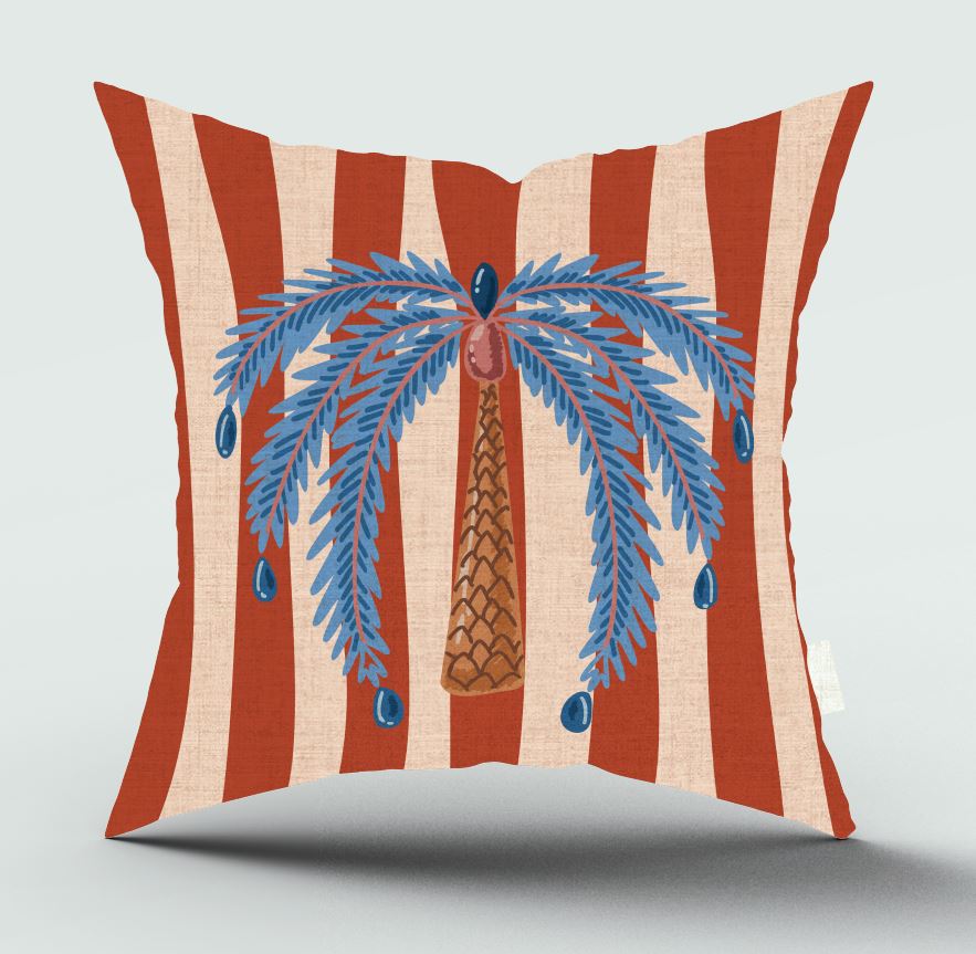 Decorative pillow with red and beige stripes and a blue palm tree design on a light gray background