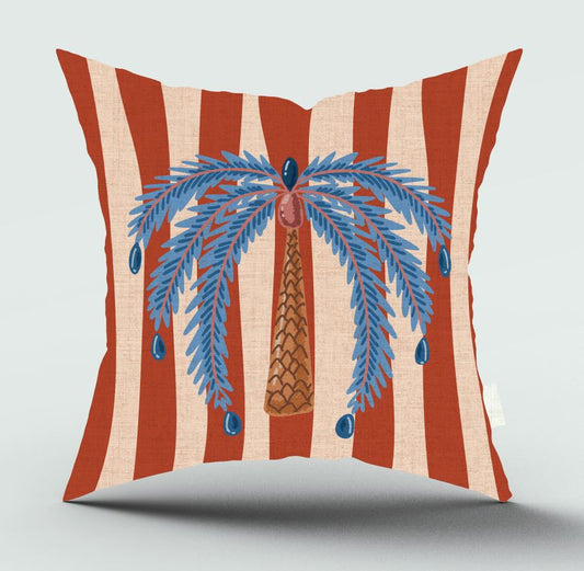 Decorative pillow with red and beige stripes and a blue palm tree design on a light gray background