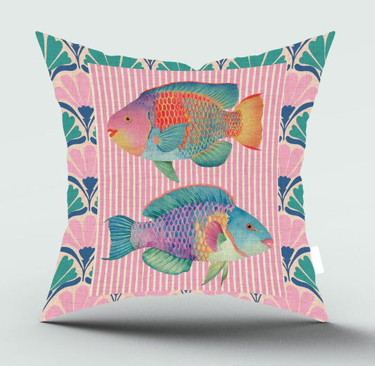 A square decorative throw pillow featuring two colorful parrotfish on a pink striped background with a teal and pink botanical border, shown against a light gray background.