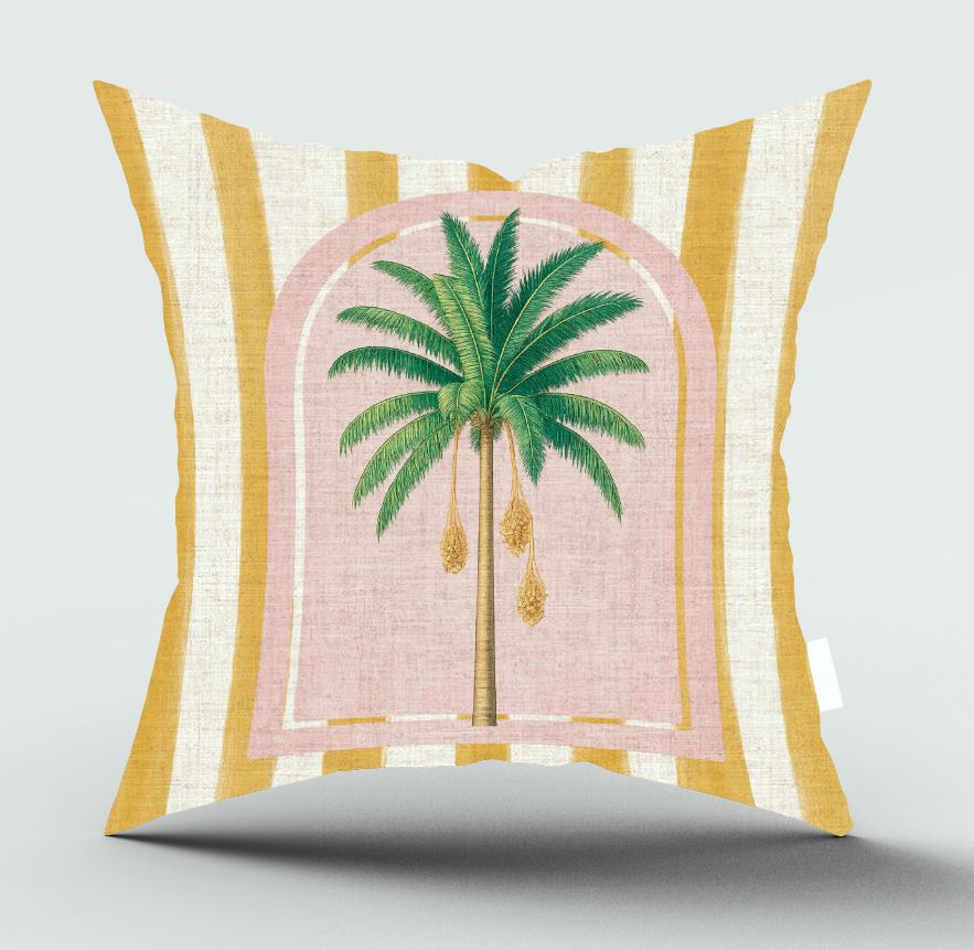 A square decorative throw pillow with a yellow and cream striped border and a central pink arched graphic featuring a green palm tree.
