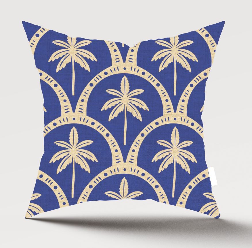 A square throw pillow featuring a navy blue and beige palm tree pattern, shown against a light gray background with a soft shadow underneath.