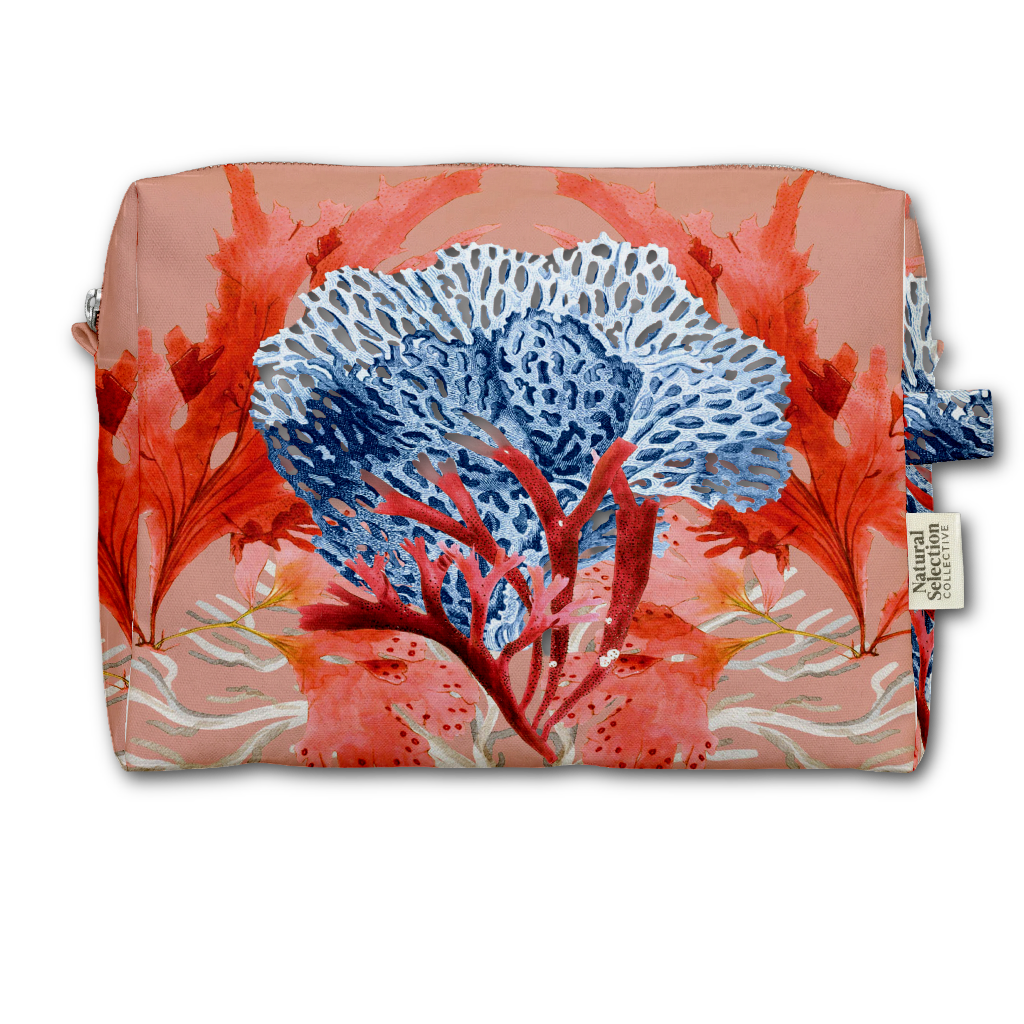 A rectangular pouch with a coral reef print in shades of blue, red, and pink, featuring a small white tag on the right side that reads 'Natural Living'.