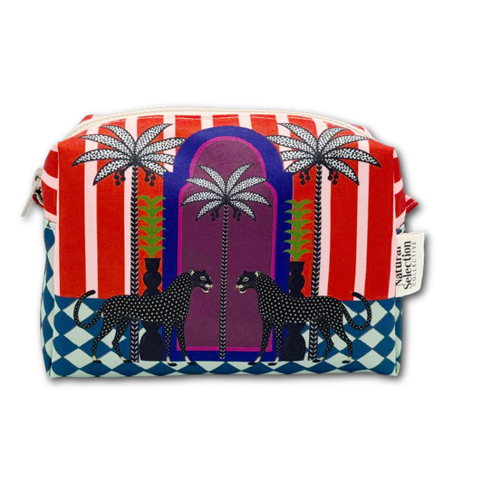 A rectangular zippered pouch featuring a vibrant Southwestern-style illustration with red and white vertical stripes, palm trees, black-and-white spotted dogs, and a blue-and-white checkered border on a white background.