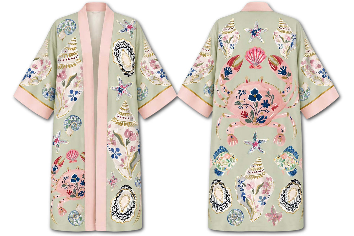 Front and back views of a light sage green kimono-style robe decorated with colorful seashell and floral motifs, featuring a pink inner placket and pink-trimmed sleeves.