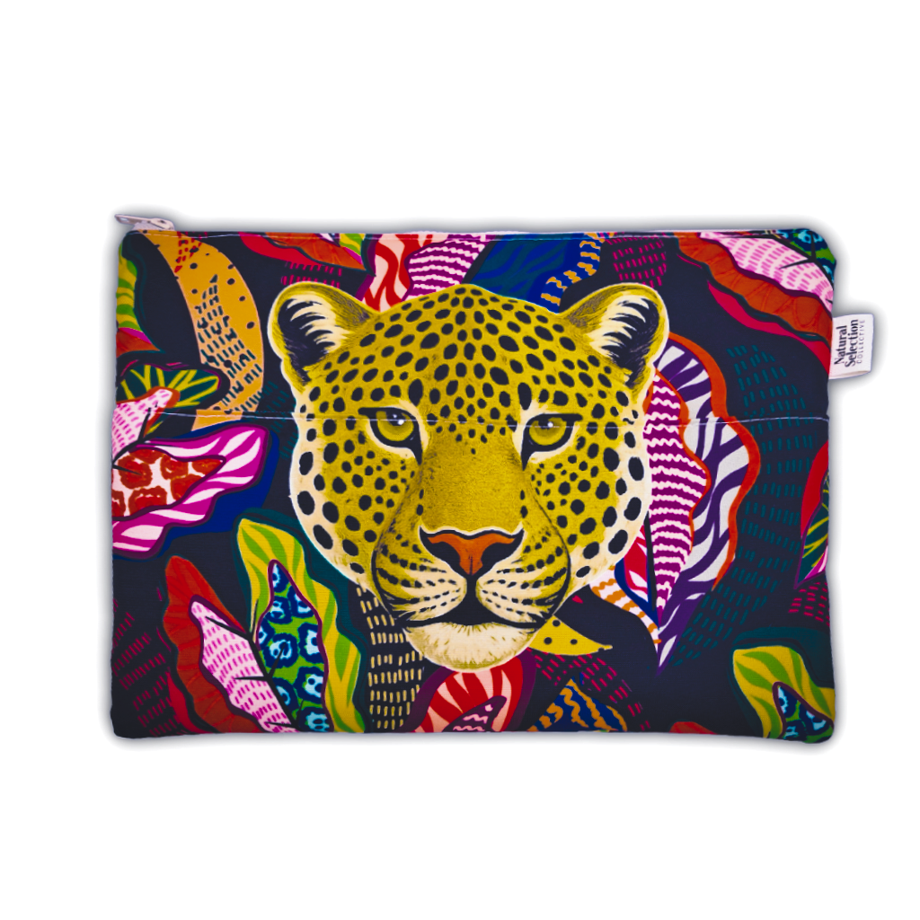 A rectangular zippered pouch featuring a vibrant, colorful graphic print of a leopard's face surrounded by tropical leaves on a dark navy background. A small white fabric brand tag is visible on the right side.