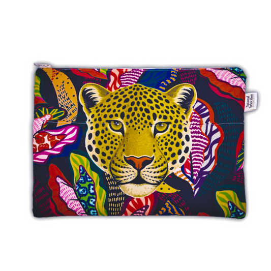 A rectangular zippered pouch featuring a vibrant, colorful graphic print of a leopard's face surrounded by tropical leaves on a dark navy background. A small white fabric brand tag is visible on the right side.