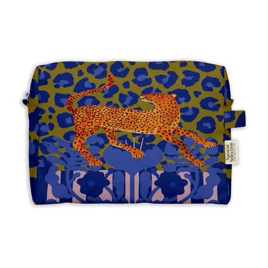 Noble Leo Toiletry Bag featuring an orange leopard leaping over blue leopard spots on olive