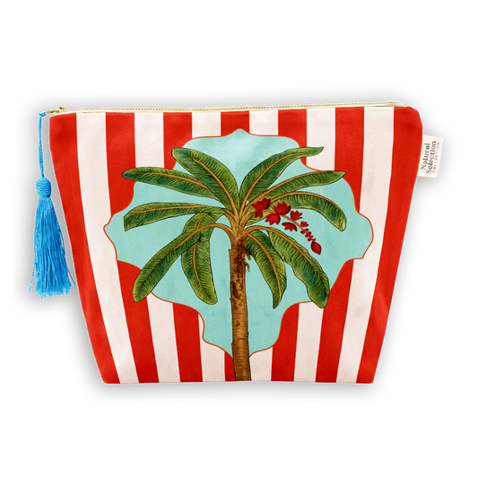 A zippered cosmetic pouch featuring a red and white striped pattern with a central illustration of a green palm tree on a light blue background. The pouch has a gold zipper, a blue tassel zipper pull, and a small white fabric brand tag on the right side.