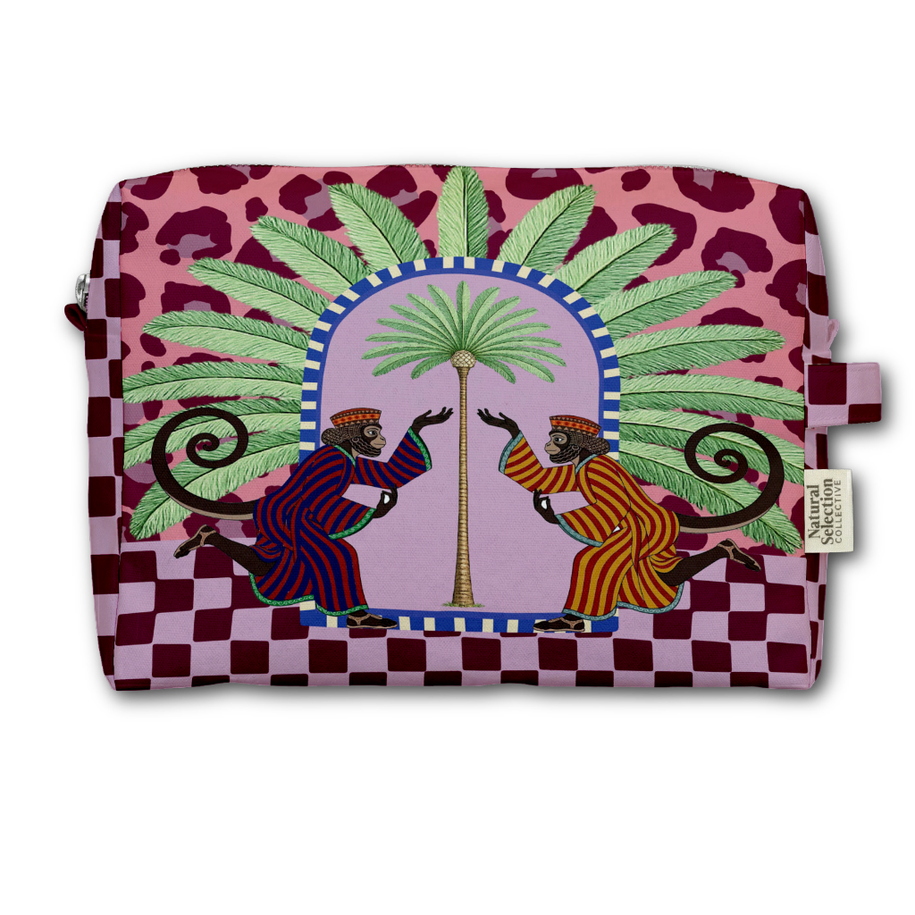 A rectangular zip pouch featuring a vibrant, colorful graphic print. The design includes a pink leopard-print top, a pink-and-white checkered bottom, a central purple arch with a palm tree, and two dancing monkeys in striped robes.