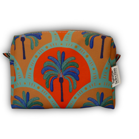 A rectangular zippered pouch featuring a retro mid-century modern design with palm trees and arches in orange, teal, blue, and green, with a white brand tag on the side.