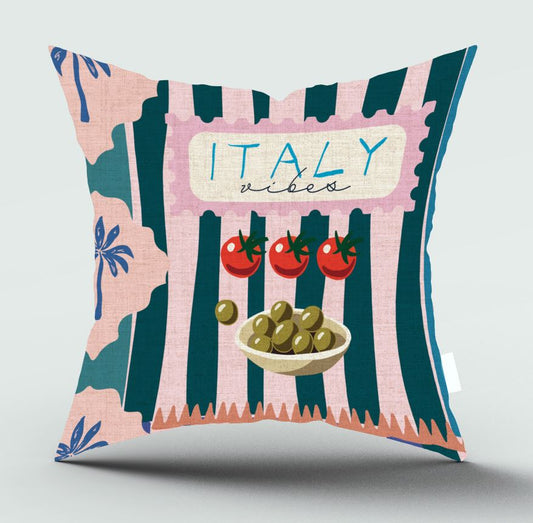 A square decorative throw pillow with an Italian theme, featuring vertical pink and dark teal stripes, a cream banner reading 'ITALY vibes', three red tomatoes, and a bowl of green olives, shown on a light gray background.