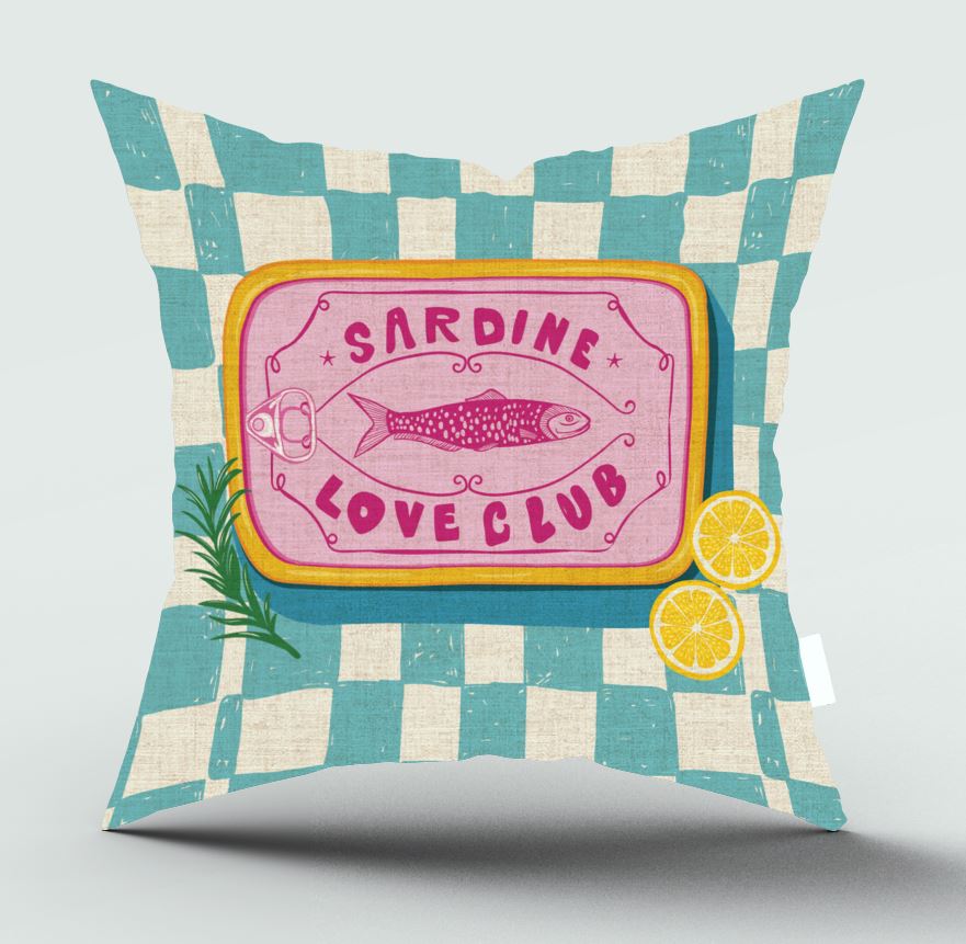 A square decorative throw pillow with a teal and cream checkered pattern, featuring a central pink label with a fish illustration and the words 'SARDINE LOVE CLUB', plus small lemon and herb graphics, shown on a light gray background.