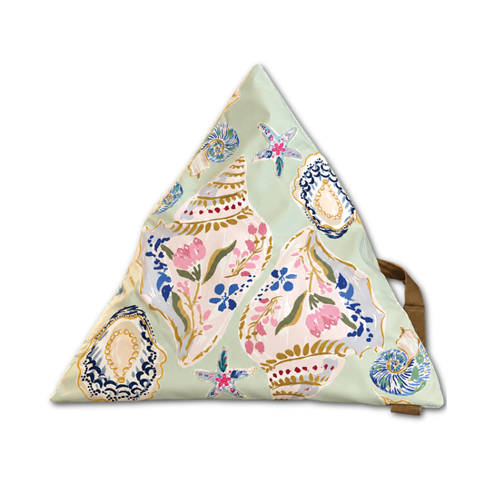 A triangular floor cushion with a light sage green base and an intricate bohemian-style floral and medallion pattern in pink, blue, gold, and white. A tan strap is visible on the right side, set against a plain white background.