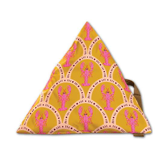A triangular fabric bag with a mustard yellow background, featuring a repeating pattern of pink lobsters inside peach arches, with a brown strap visible on the right side.