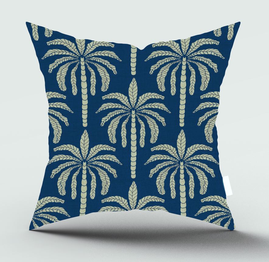 A square throw pillow with a navy blue background and a repeating cream-colored palm tree pattern, shown against a light gray background.