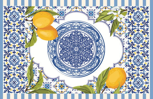 Tuscan Siesta Tablecloth featuring lemons and a blue and white plate on blue tiles