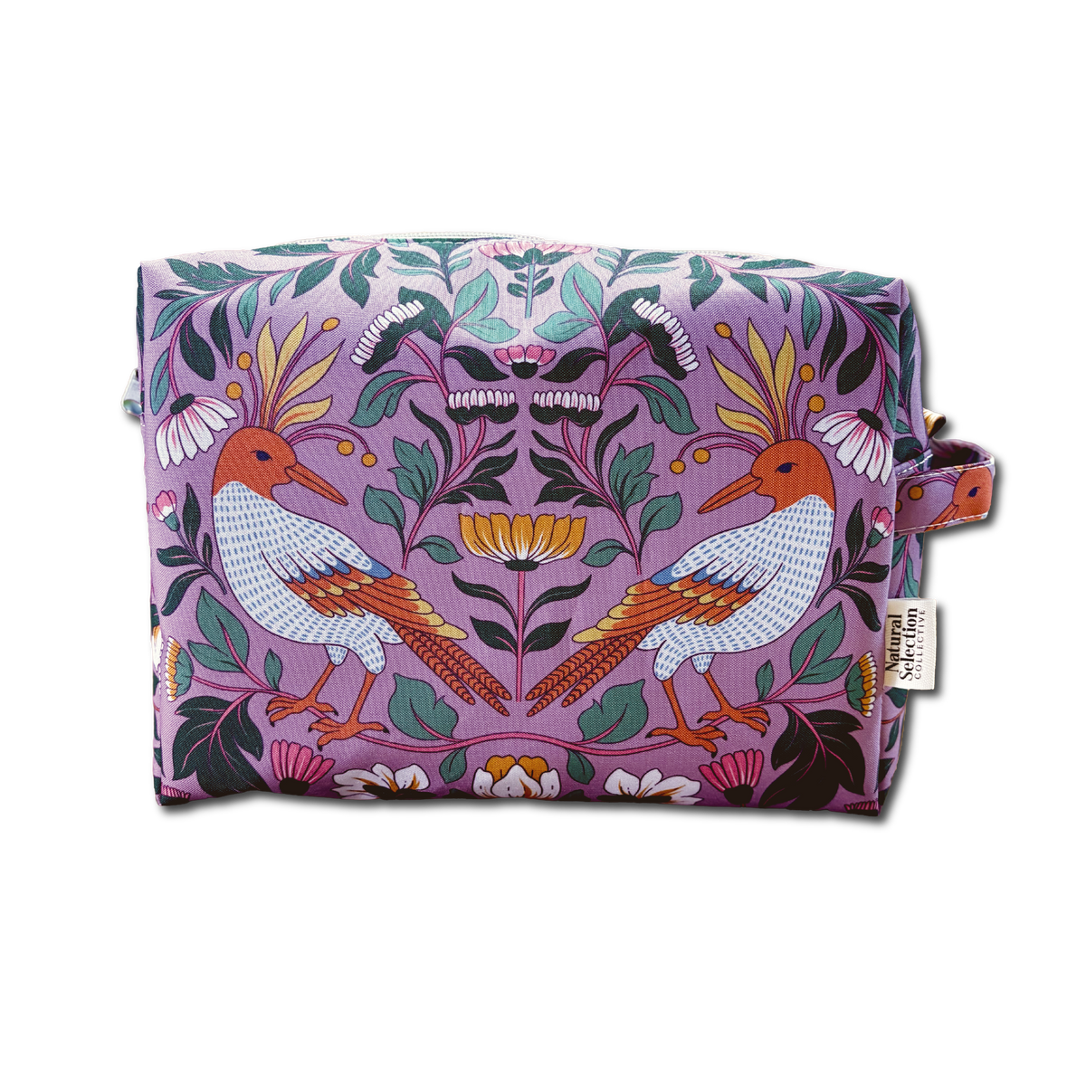A rectangular cosmetic pouch with a symmetrical floral and bird pattern on a lavender background, featuring two stylized birds and a small side loop with a fabric tag.