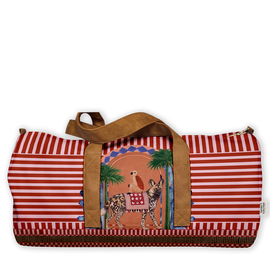 Wild Dog Hamazi Duffel Bag featuring African wild dogs and palm trees in an arched frame