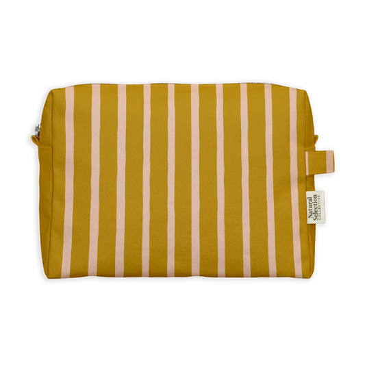 Crocus Stripe Toiletry Bag featuring blush pink stripes on mustard