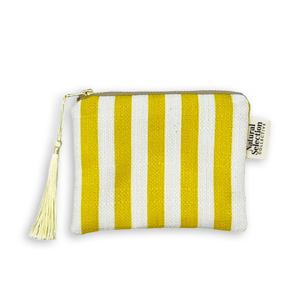 A small fabric zip pouch with vertical yellow and white stripes, featuring a cream tassel zipper pull and a side tag reading Natural Selection.